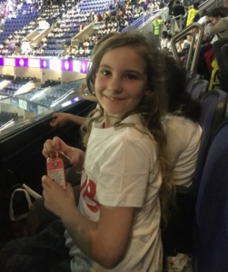 Smiling child in the stands of the stadium 